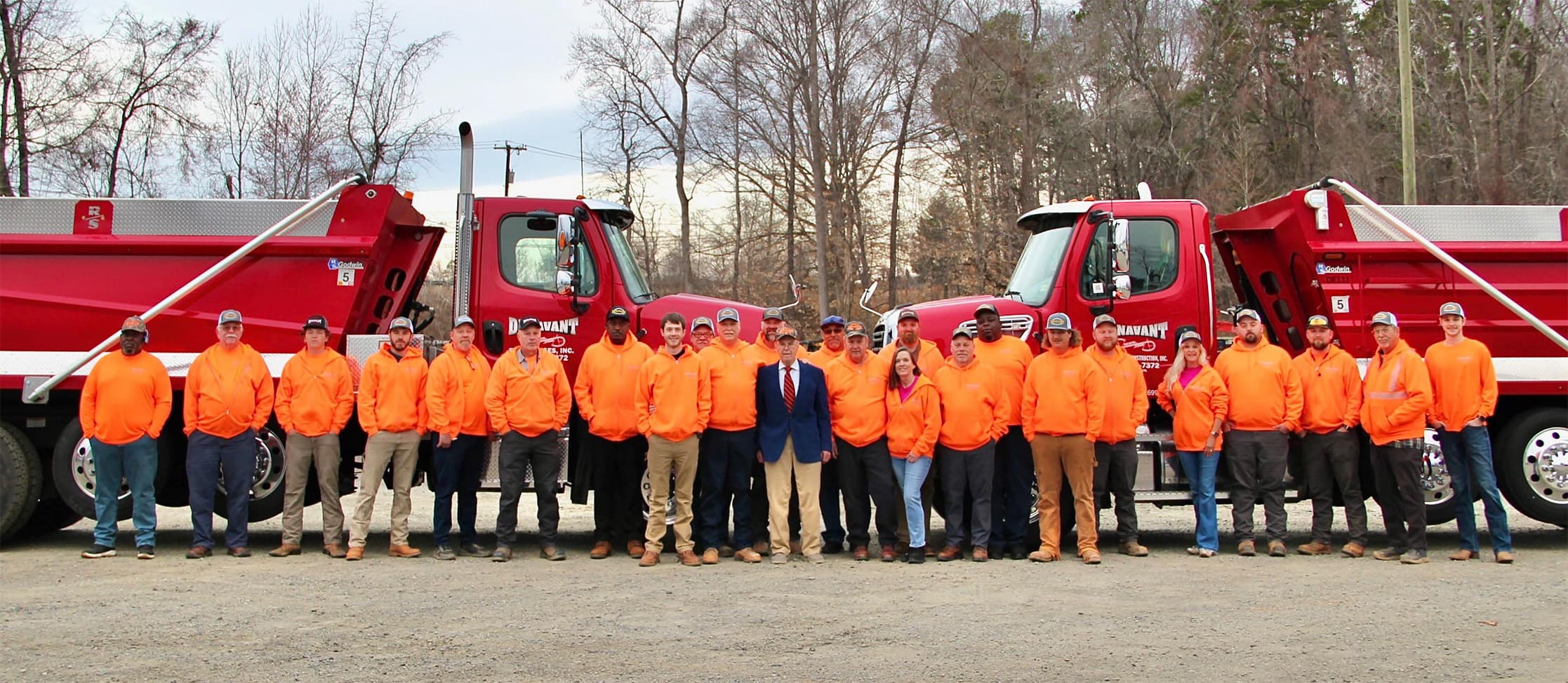 Dunavant Engineering team standing in front of company trucks